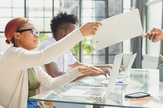 african american woman takes documents check report