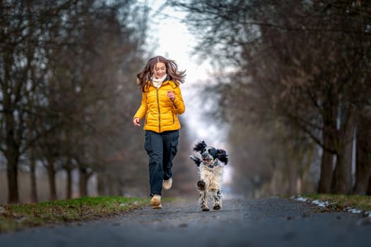 teenager with a dog on a walk in the park. High quality photo