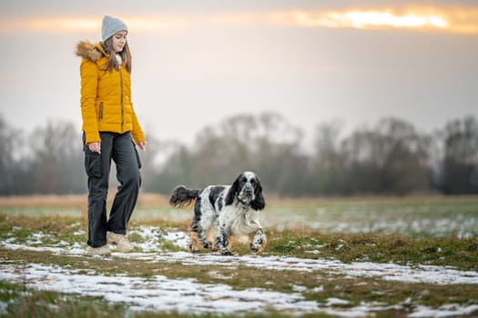 teenager with a dog on a walk in the park. High quality photo