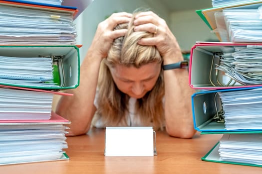 accountant in stress among colorful folders, mockup. High quality photo