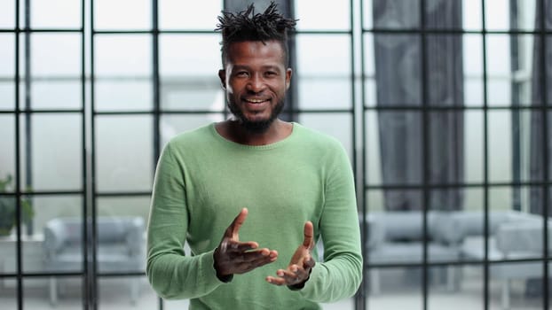 Portrait of a happy African American entrepreneur in office