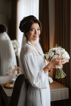 morning of the bride with the creation of the image of makeup and the creation of hairstyles