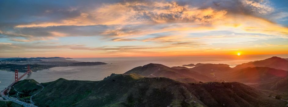 Sunset over Pacific Ocean with Golden Gate Bridge and Marin Headlands. High quality photo