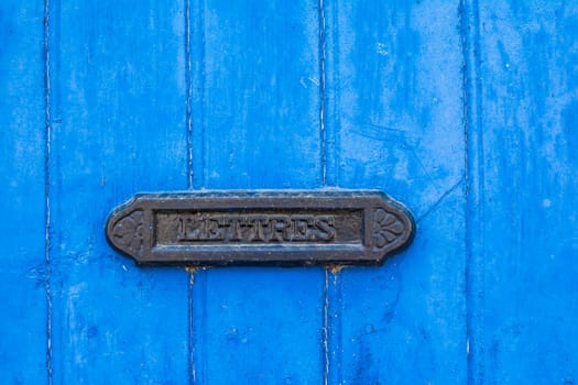 blue shabby door with french vintage mailbox
