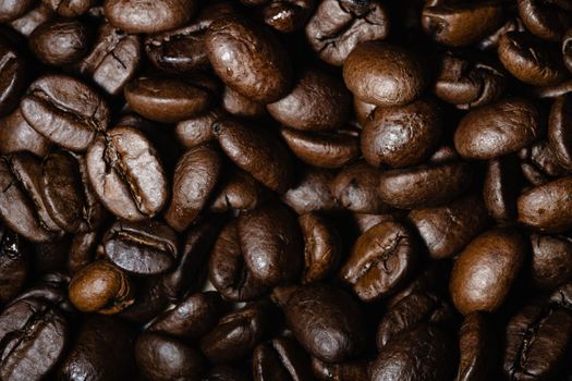 Roasted coffee beans background. Freshly roasted coffee beans background