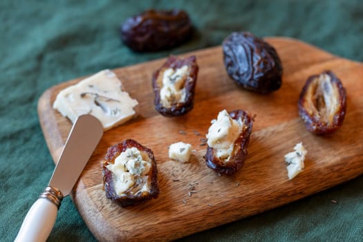 date fruits stuffed with gorgonzola cheese, side view