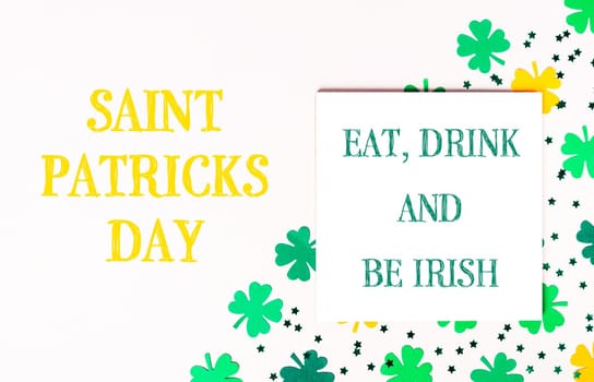 St. Patrick's day holiday celebration. Lettering eat, drink and be Irish on a white background. High quality photo