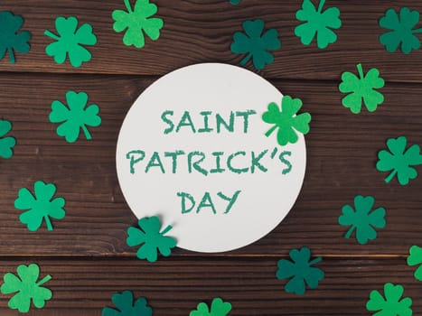 round card with text for st patrick's day on wooden background High quality photo