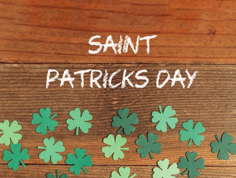 St. Patrick's Day greeting card with lettering Saint Patricks Day on a wooden background. High quality photo
