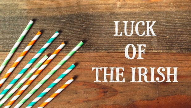 Luck of the Irish, March 17th, St. Patrick's Day celebration. Suitable for design greeting cards, posters. On a wooden background