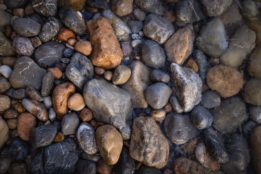 The erosion of water on the rocks, textures and patterns generated on the stones of the beach Ibiza island.