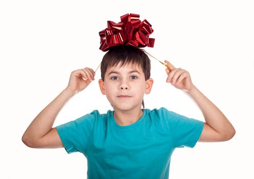 little boy with a red bow in hand