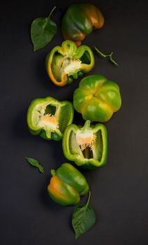 sweet pepper, green bell pepper on black background