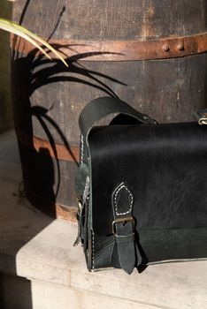 close-up photo of black leather bag corporate. street photo