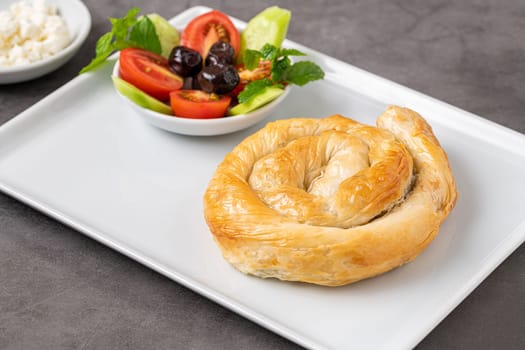 Traditional Turkish pastry made with spinach and cheese wrapped in phyllo. Turkish name gul boregi or gul borek