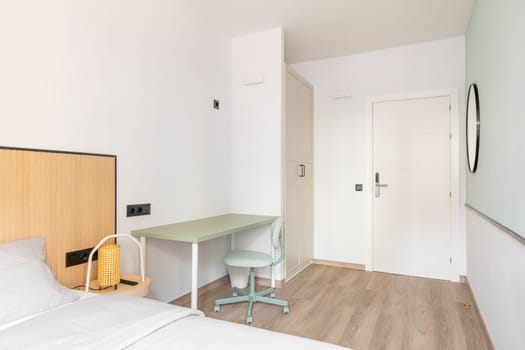 Brightly lit room with daylight bright light. Room for extended stay. Wardrobe for clothes, table and chair for working space, bed for sound sleep. Entrance door with electronic lock