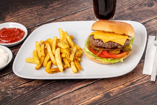 Cheeseburger with Tomatoes and Pickles with French Fries and Ketchup