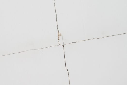 The gypsum boards covered on the ceiling due to expansion cracked by opening from the joints