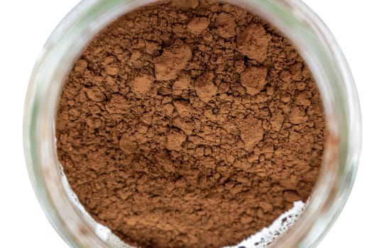 Top view of cocoa powder in glass jar