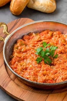 Turkish traditional menemen dish made with eggs, onions, peppers and tomatoes