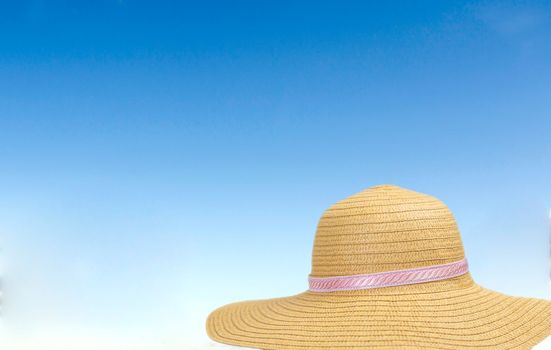 summer sunshine straw hat in blue sky on a sunny day. sunglasses summer concept with copy space blue background relaxation, Holiday,travel, beach,sun concept close up