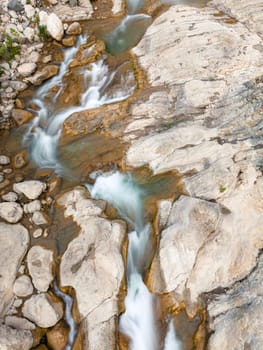 River flowing between rocks with motion blur shot with long exposure technique