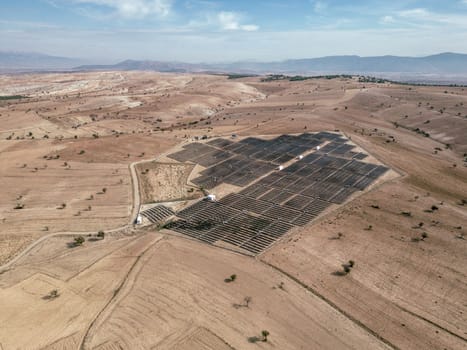 Solar panel field built on arid lands. Alternative green energy concept
