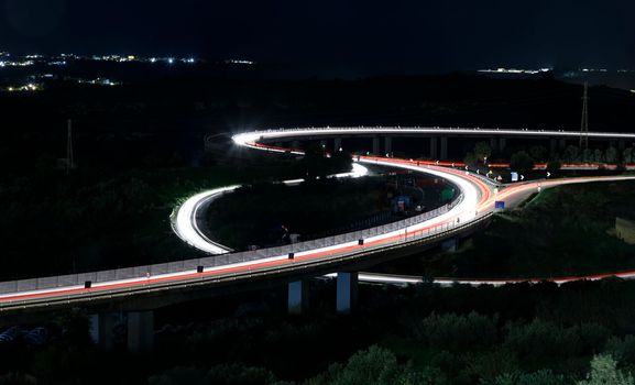 Aerial view of a part of a road junction at night. Transportation and infrastructure concept