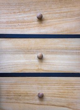 Wooden cupboard with drawers. Wooden furniture. Close-up