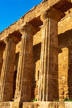 Columns of the ancient ruins of the greek temple of Segesta in Sicily, Italy. Vertical view