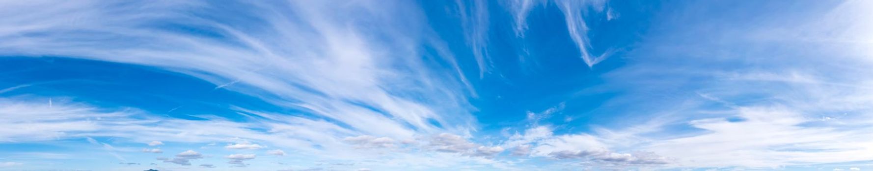 Panoramic view of blue sky with fluffy clouds
