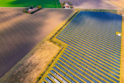 Agriculture and fields next to solar panels of a solar park in rural Germany