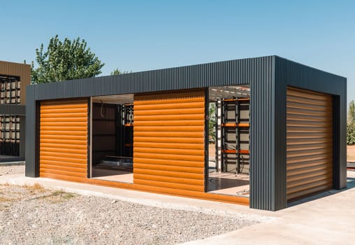 Newly built metal framed building with siding. Construction of a new tiny house. selective focus