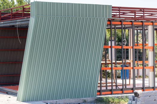 Newly built metal framed building with siding. Construction of a new tiny house. selective focus