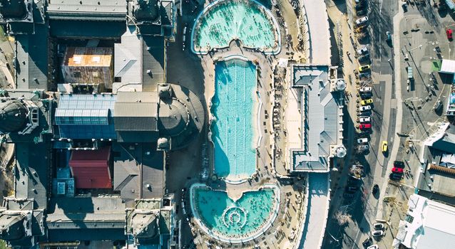 Aerial drone view of the famous Szechenyi Thermal Bath and Spa on a sunny autumn day in Budapest, Hungary. High quality photo