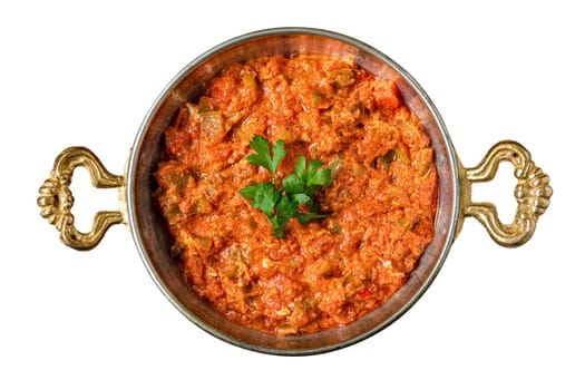 Turkish traditional menemen dish made with eggs, onions, peppers and tomatoes on white background