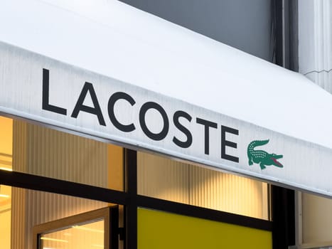 Antalya, Turkey - November 29, 2022: Illuminated logo of Lacoste store in Antalya Turkey