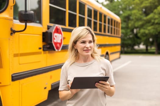 a woman near a school bus.