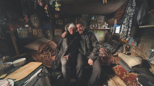 A homeless couple tells a story in their cabin