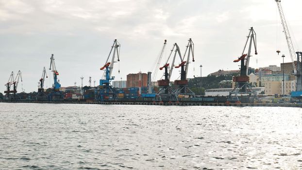 The seaport of Vladivostok with cranes. View from the ferry