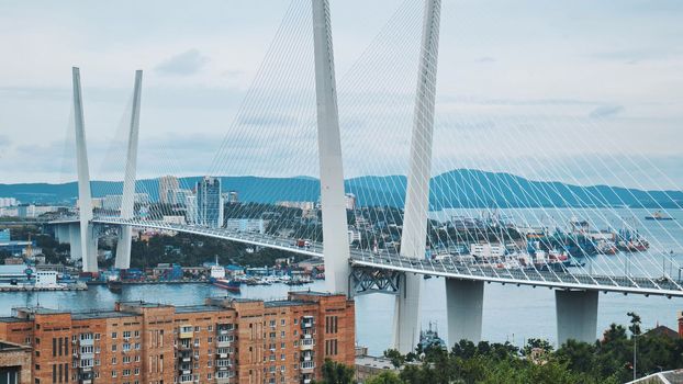Traffic on the white bridge in the city of Vladivostok