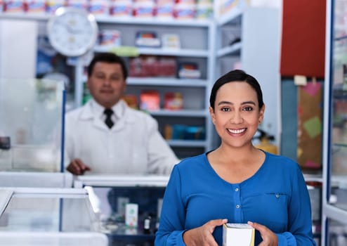 Ive got my medication, now to get better. a male pharmacist and female customer in a pharmacy