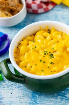 Delicious Mac n Cheese or macaroni and cheese on a green porcelain plate