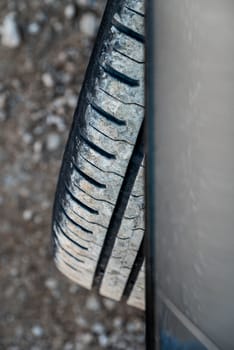 Top view of worn and worn car tire and car