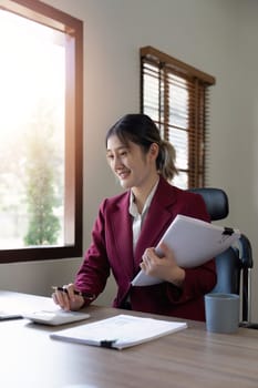 Businessman hands using text information on laptop to analyze financial statistical chart data and calculate cost of investment project.