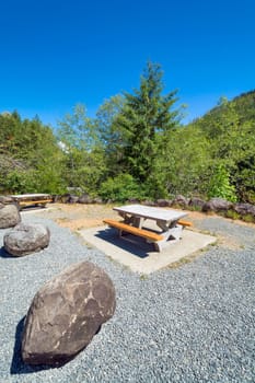 Rest area with concrete table on a hiking route.