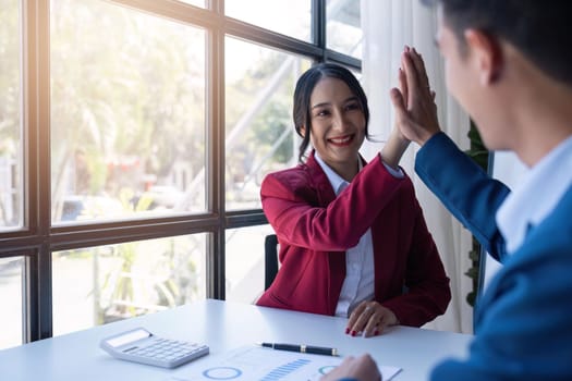 Happy smiling businessman feel happy work complete Teamwork success at work in the office concept.