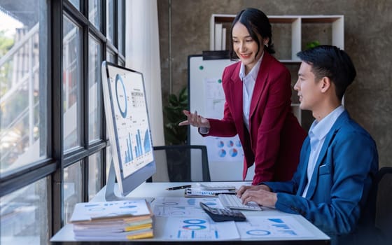 Young Asian business team creative businesspeople coworker in office. Meeting Presentation for tax analysis graph company financial. People Work in Business Office.