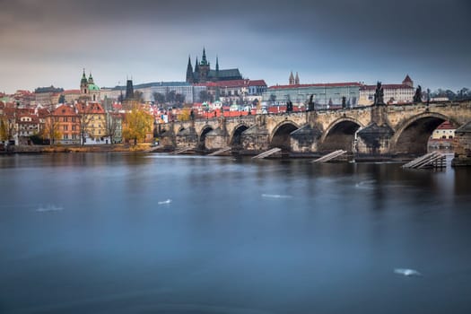 Panoramic view over the cityscape of Prague and Vltava river at dramatic sunset, Czech Republic