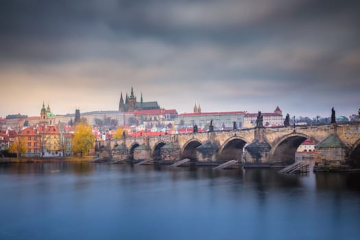 Panoramic view over the cityscape of Prague and Vltava river at dramatic sunset, Czech Republic